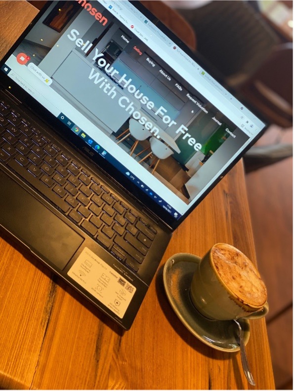 selling property in sutton coldfield laptop on table with coffee at max's coffee shop in sutton coldfield