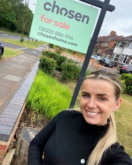 selling property in sutton coldfield hannah in front of chosen for sale board outside home for sale