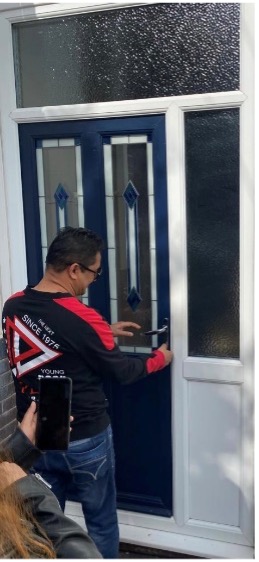 sell house in sutton coldfield buyer putting keys in door of new house